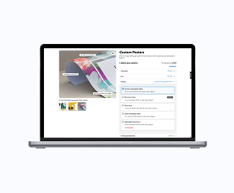 A laptop computer showing Staples print site with the posters product configurator