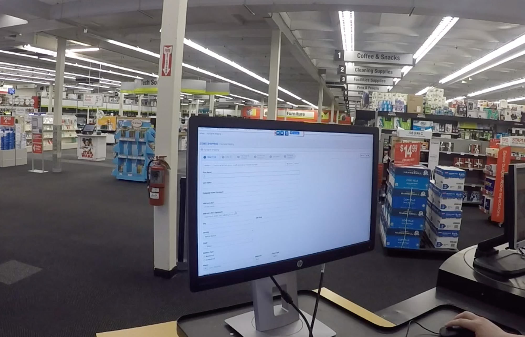 Photo of a computer inside a retail store displaying Falcon, an application that is used to create and process the shipment of packages.